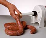 Using the Dakotah Sausage Stuffer to make Bratwurst.  After one casings is full, just twist the brats about every 6 inches.  First clockwise, then twist the next section counter clockwise.  You can then cut the brats apart with a knife or leave them in a twisted, long link to smoke, grill or fry.